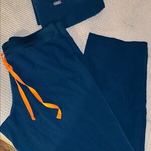 Figs Livingston pants size L/P. Color deep reef.